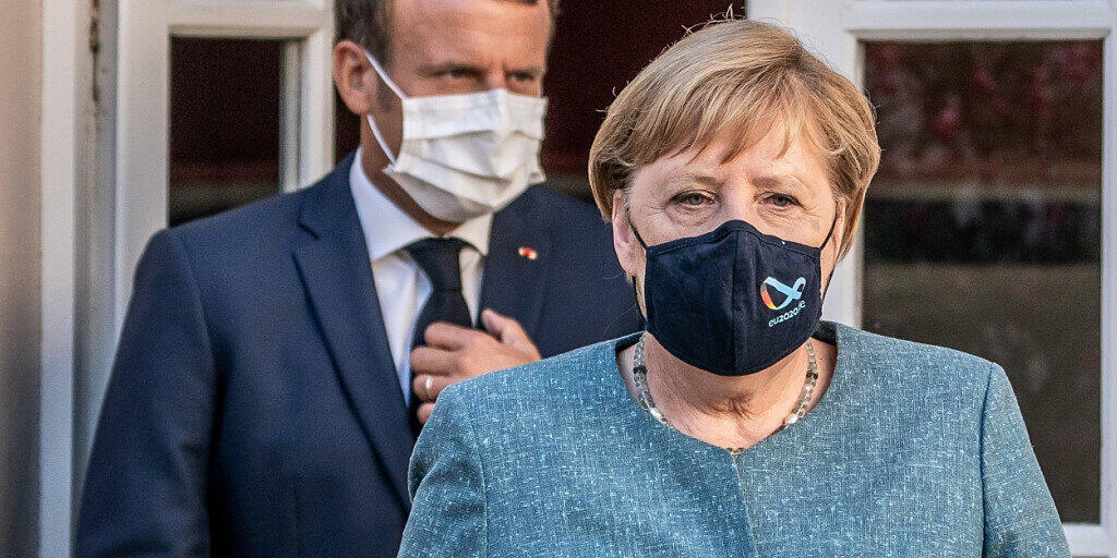 ARCHIV - Emmanuel Macron und Angela Merkel bei einem Treffen im August. Foto: Michael Kappeler/dpa