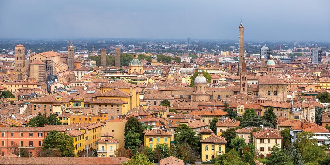 Aerial view of red tiled rooftops and ancient towers in historic