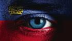 Human face painted with flag of Liechtenstein