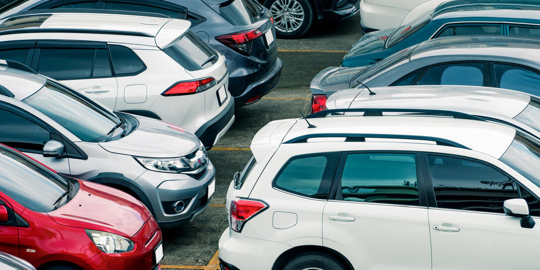 Car parked at parking lot of the airport for rental. Aerial view of car parking lot of the airport. Used luxury car for sale and rental service. Automobile parking space. Car dealership concept.