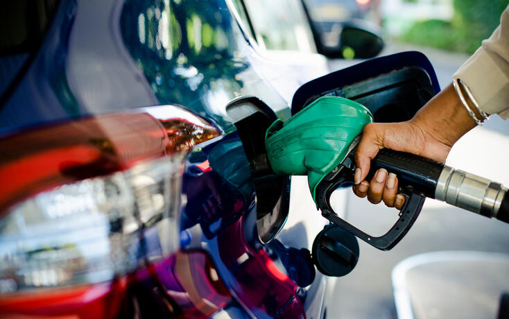 Man filling up gas in his car