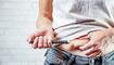 A woman injects insulin with insulin injection device into the subcutaneous tissue of abdomen