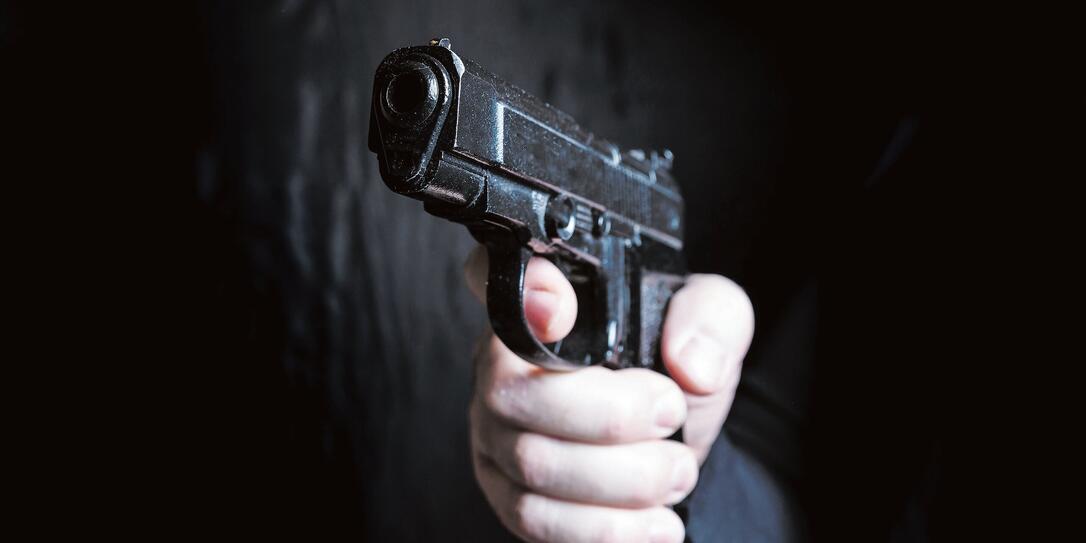 gun in the hand of man