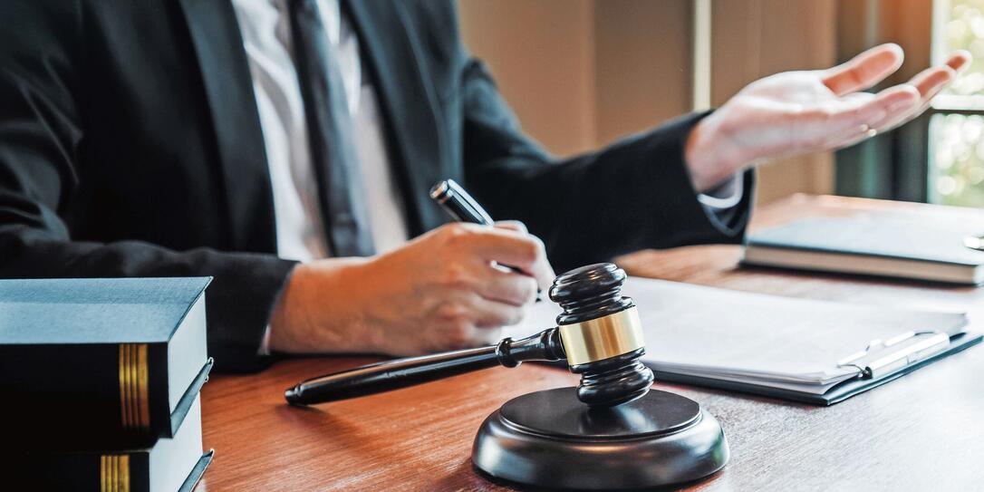 Businessman shaking hands to seal a deal Judges male lawyers Consultation legal services Consulting in regard to the various contracts to plan the case in court.