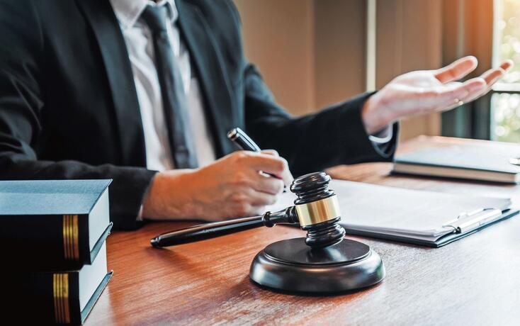 Businessman shaking hands to seal a deal Judges male lawyers Consultation legal services Consulting in regard to the various contracts to plan the case in court.