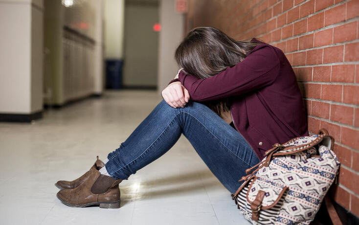 A Young depress female student at the college