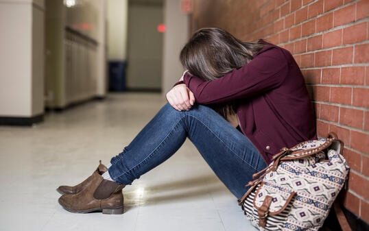 A Young depress female student at the college