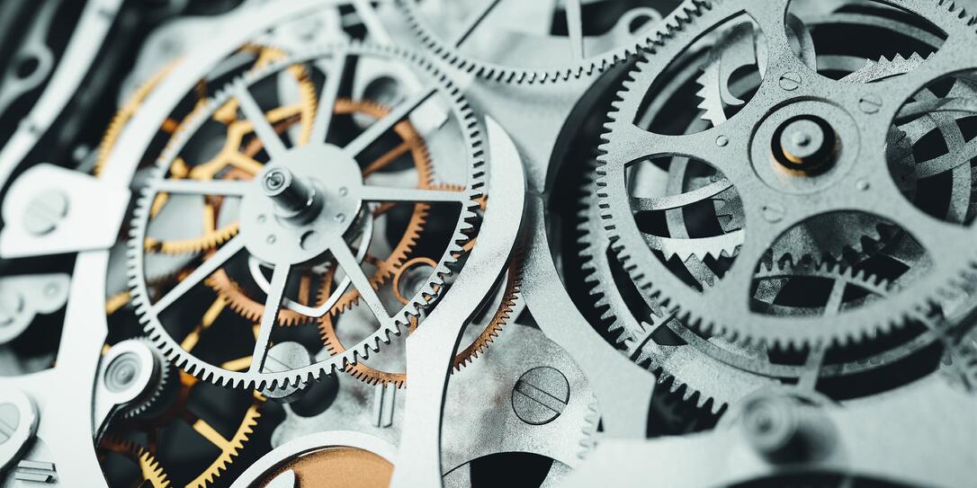 Gears and cogs in clockwork watch mechanism. Craft and precision