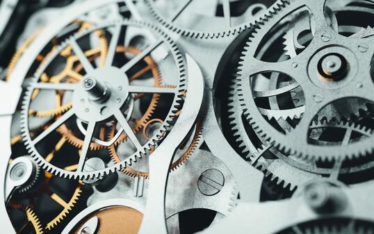 Gears and cogs in clockwork watch mechanism. Craft and precision