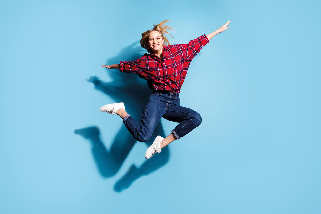Full length body size view portrait of nice charming cute attractive cheerful cheery teen girl wearing checked shirt flying like plane isolated on teal turquoise bright vivid shine background