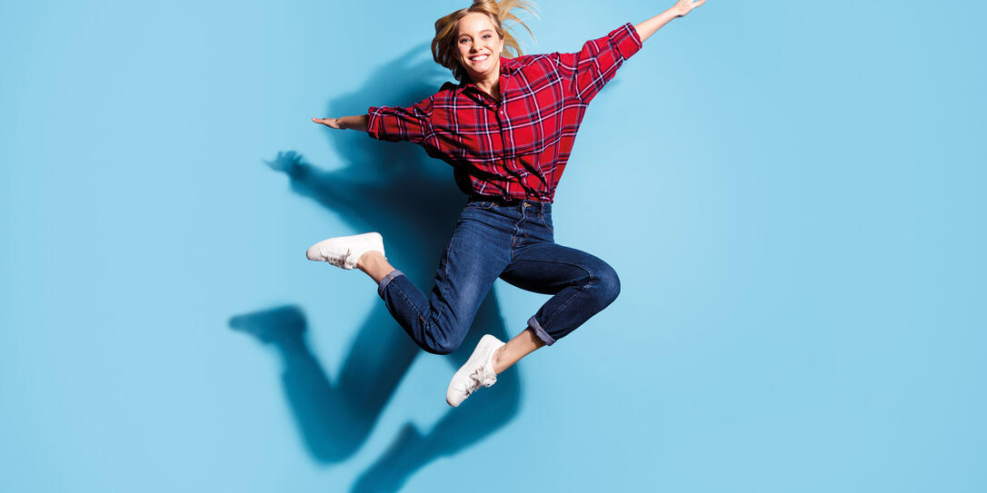 Full length body size view portrait of nice charming cute attractive cheerful cheery teen girl wearing checked shirt flying like plane isolated on teal turquoise bright vivid shine background