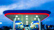 Blur image of twilight gas station during sunset.