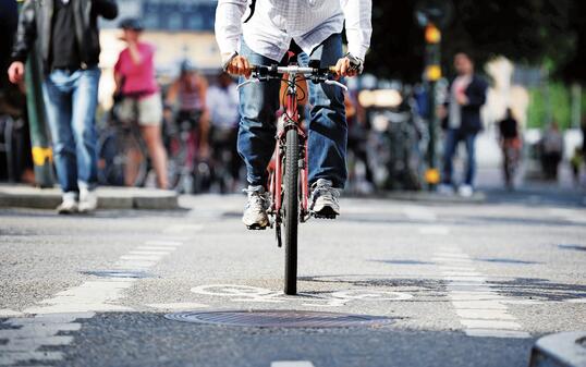 Front view of bicycle in bike lane and traffic