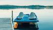 Old Blue Pedal Boat Tied To Wooden Dock Pier At Canadian Ontario Lake In Muskoka. Travel Canadian