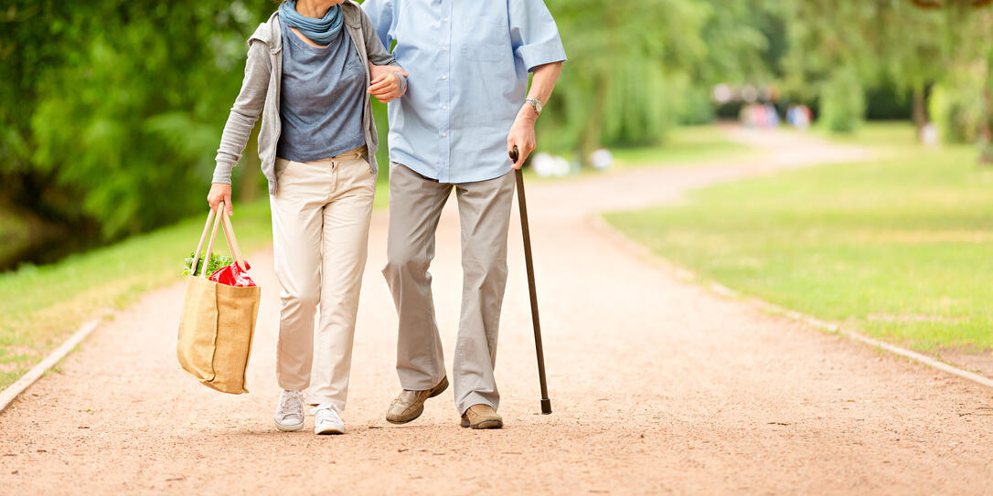Caregiver – woman helping senior man with shopping Caregiver – woman helping senior man with shopping