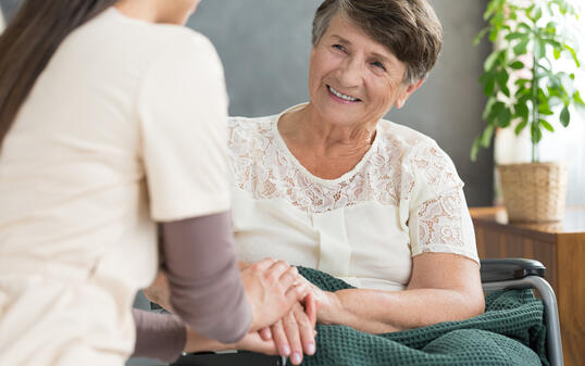 Smiling old lady and nurse
