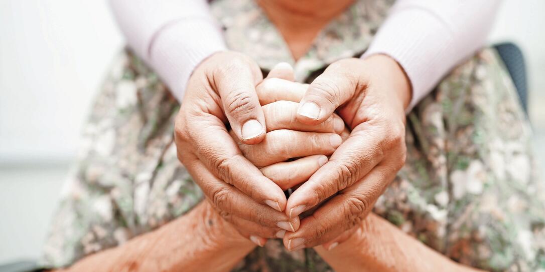 Caregiver holding hands Asian elderly woman patient, help and care in hospital.