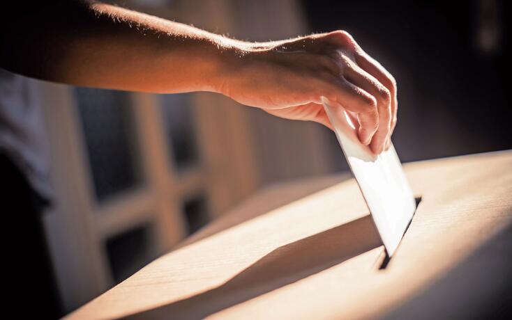 Conceptual image of a person voting during elections