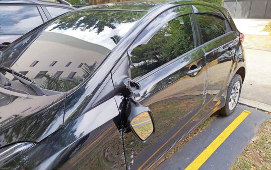 Car accident, car with a broken outside rear view mirror