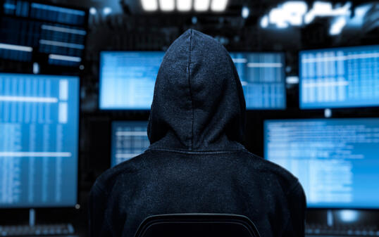 computer hacker with device screen