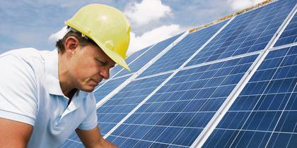 Man installing solar panels