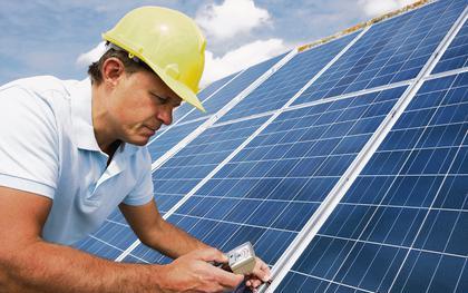 Man installing solar panels