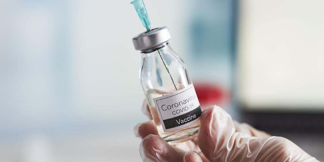The doctor prepares the syringe with the cure for vaccination. The doctor prepares the syringe with the cure for vaccination.