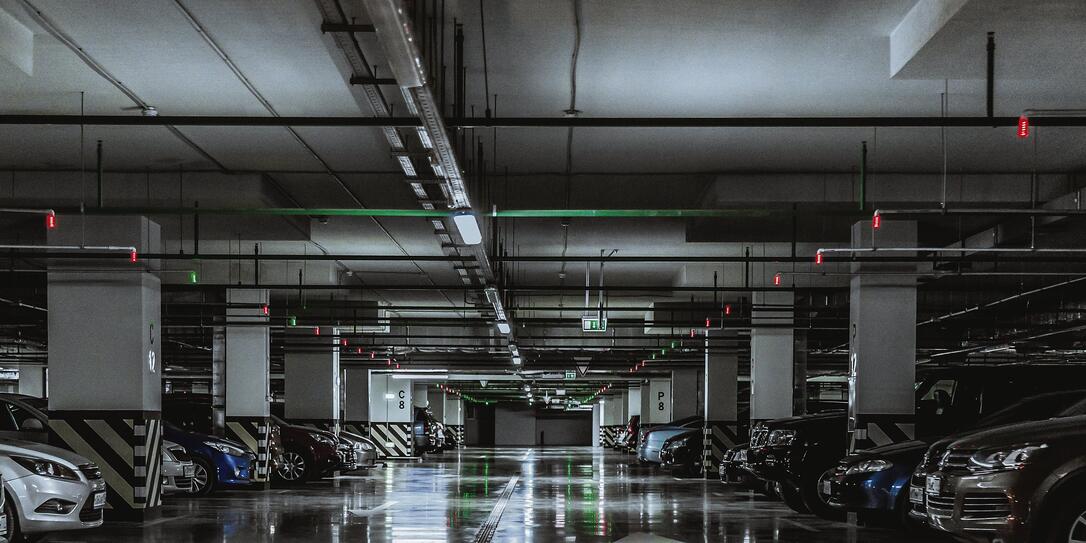 Parking garage with a few parked cars