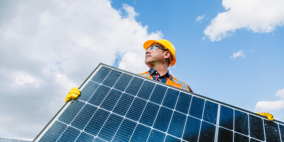 Solar Module Mounting: Professional Electrician in Photovoltaic Farm Power Station