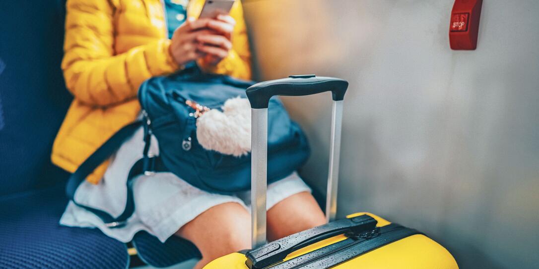 Tourist texting in the bus