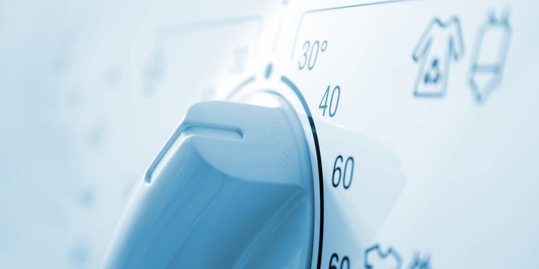 Temperature knob in the washing machine.