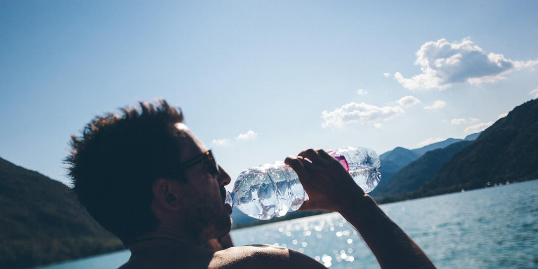Man Drinking on a boat