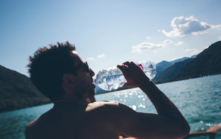 Man Drinking on a boat