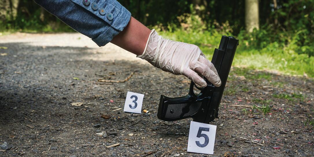 Investigator collects evidence - crime scene investigation Investigator collects evidence - crime scene investigation