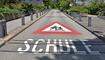 Warning sign of the way to school in German language  in Switzerland.