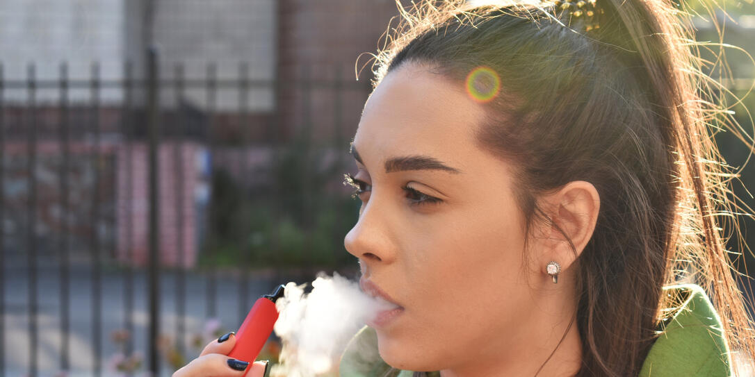 beautiful brunette smoke electronic cigarette