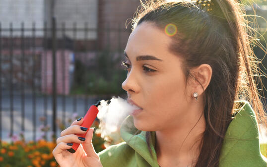 beautiful brunette smoke electronic cigarette