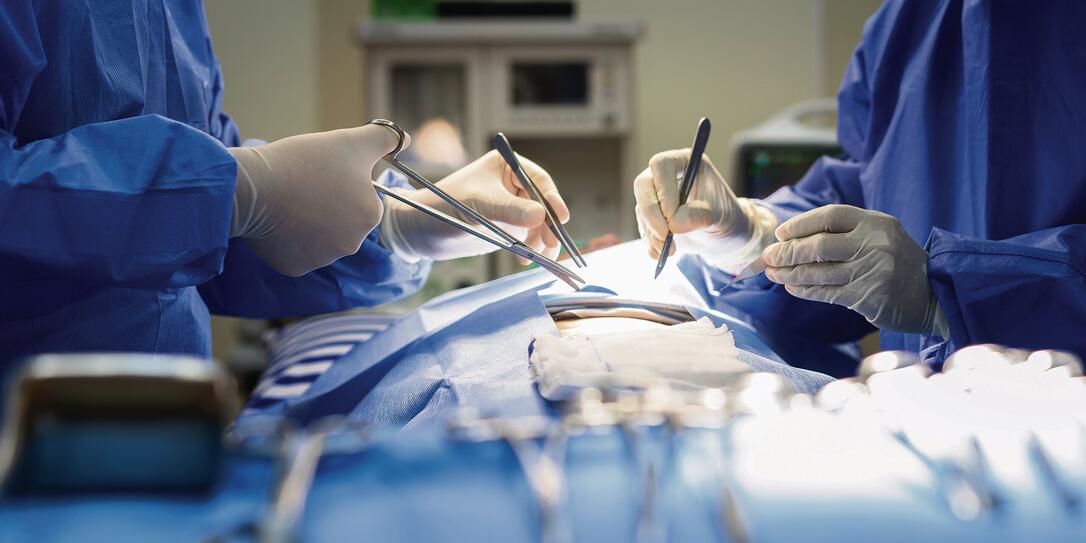 Asian doctor and an assistant in the operating room for surgical venous vascular surgery clinic in hospital.