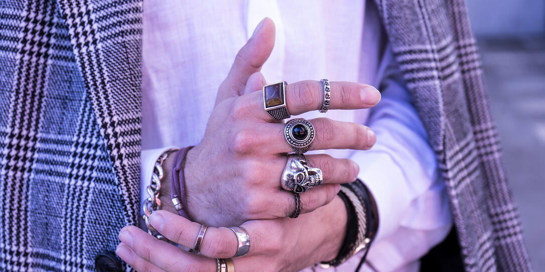 Handsome Hands with Trendy Silver Bracelets and Rings with skull