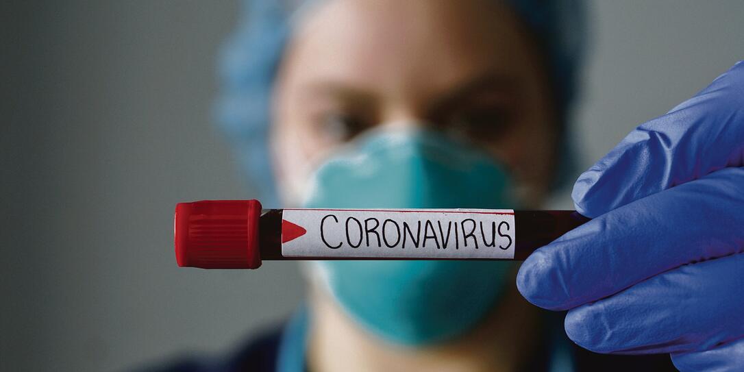 Nurse wearing respirator mask holding a positive blood test result for the new rapidly spreading Coronavirus, originating in Wuhan, China Nurse wearing respirator mask holding a positive blood test result for the new rapidly spreading Coronavirus, originating in Wuhan, China