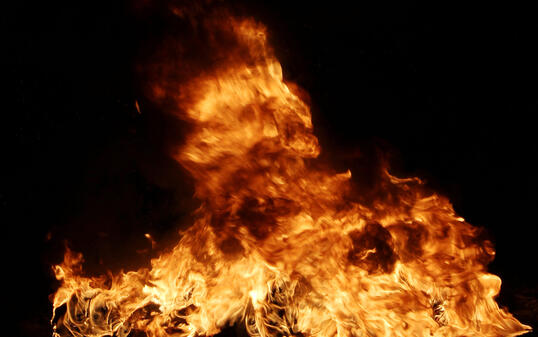 Burning tires creating big black smoke and pollution.