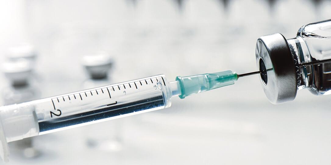 Vaccine bottle and syringe closeup