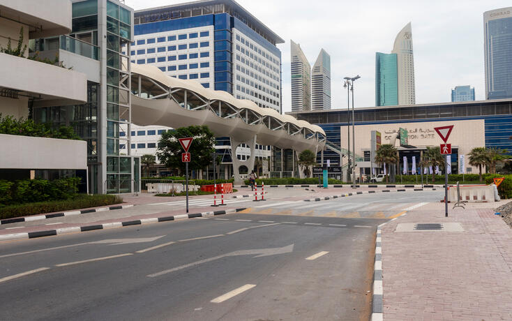 Multilevel parking and footbridge crossing at Dubai World trade center. City