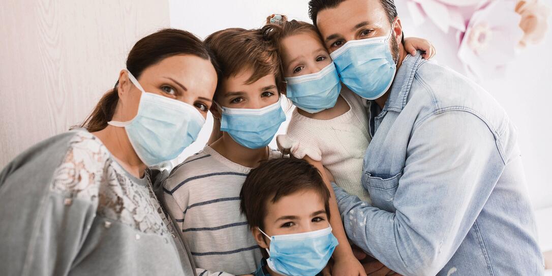 Portrait of a family at home during a Corona virus