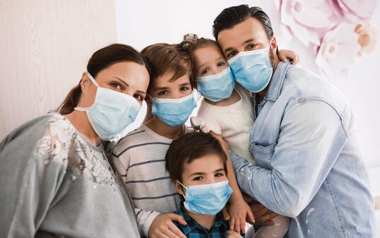 Portrait of a family at home during a Corona virus