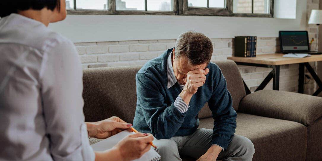 Despaired short-haired patient having mental issues and explaining them Despaired short-haired patient having mental issues and explaining them