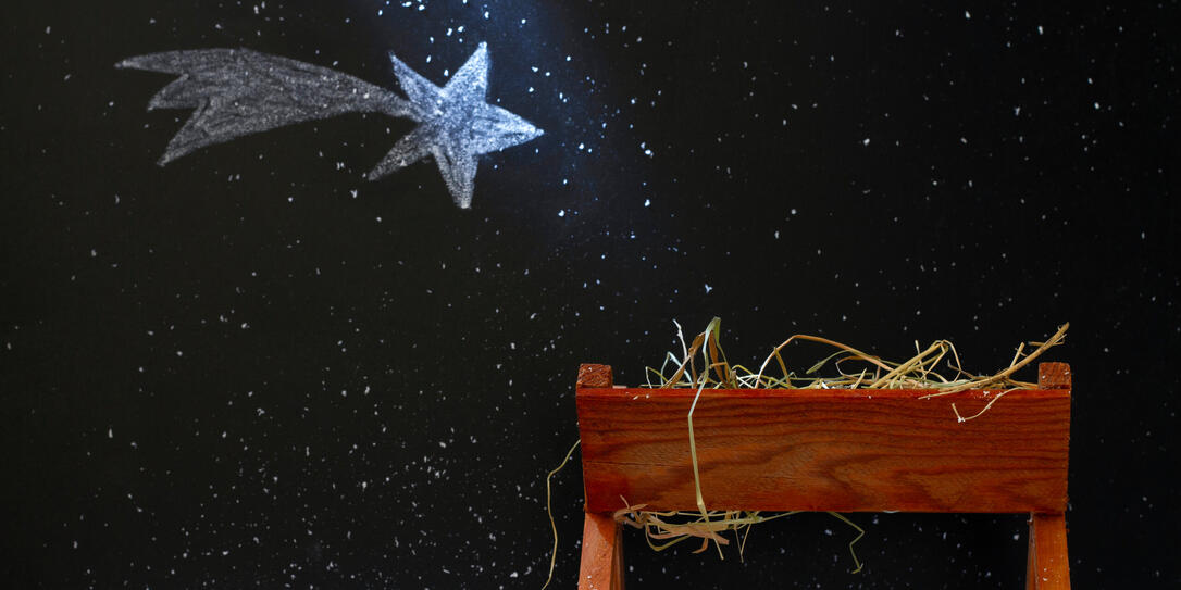 Manger and star of Bethlehem on snowy night, abstract christmas nativity scene concept