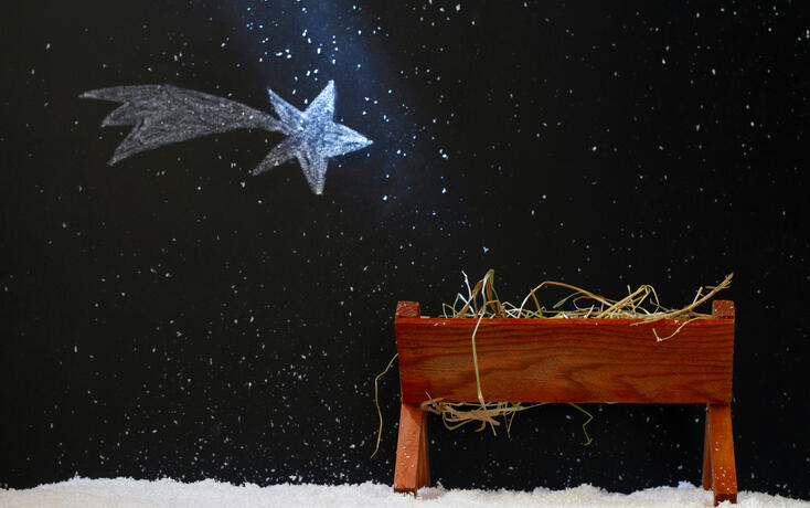 Manger and star of Bethlehem on snowy night, abstract christmas nativity scene concept