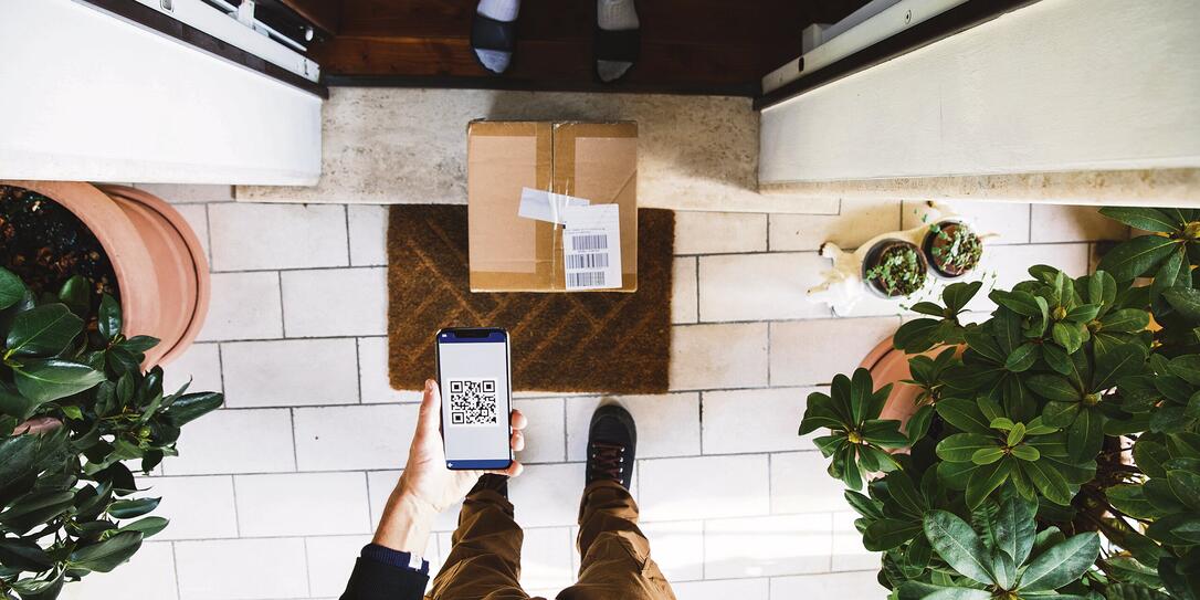 Package delivery during Covid-19 outbreak. The man is keeping social distancing Package delivery during Covid-19 outbreak. The man is keeping social distancing