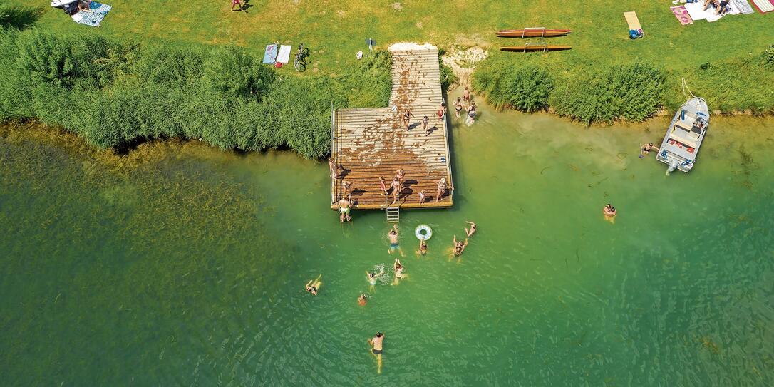 Aerial View of People Sunbathing and Swimming Aerial View of People Sunbathing and Swimming